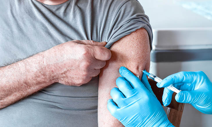 Older man receiving the Shingles vaccine