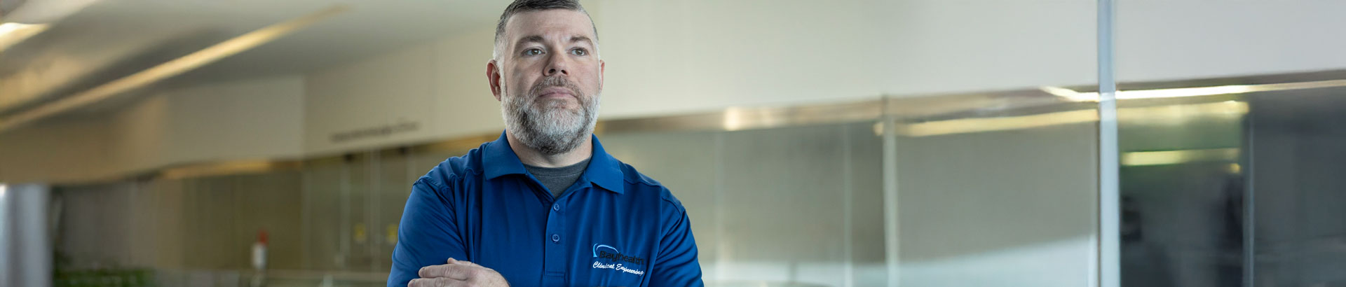 Plant Operations worker with arms crossed