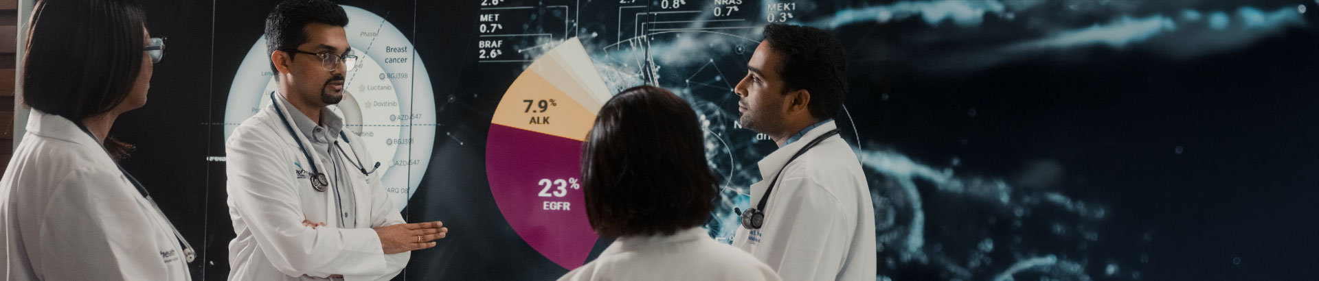 Oncologists discussing a patient's cancer care.