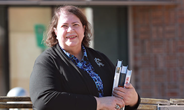 Bayhealth outpatient knee replacement patient sitting on bench